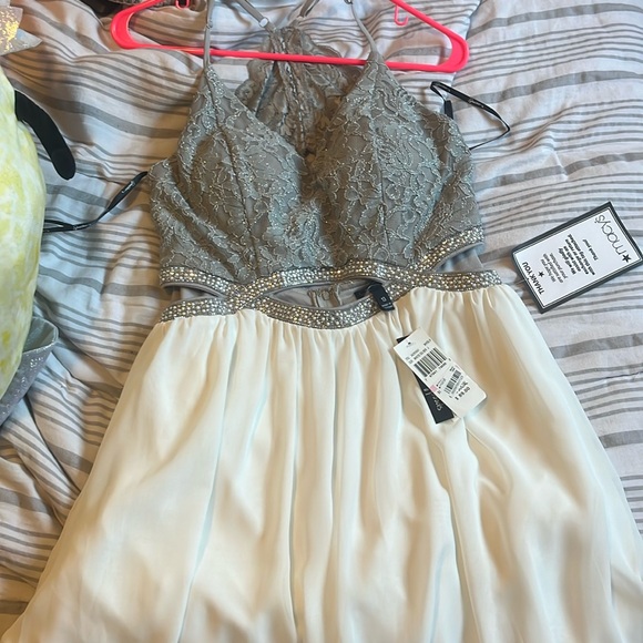 White skirt. sparkly mid section, with gray top. Cut outs w/ pearls and sparkles - Picture 1 of 4